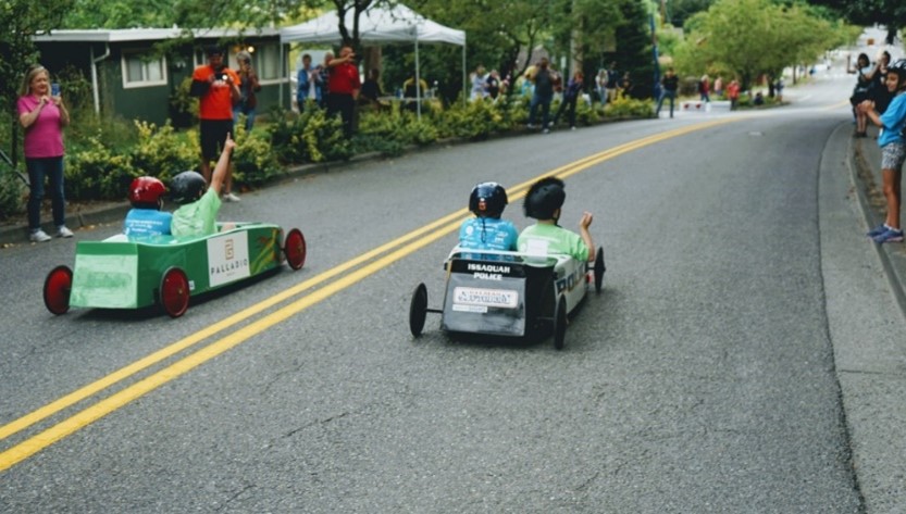 Children in soapbox derby racers